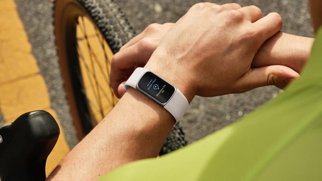 Fitbit next to bicycle - person checking stats