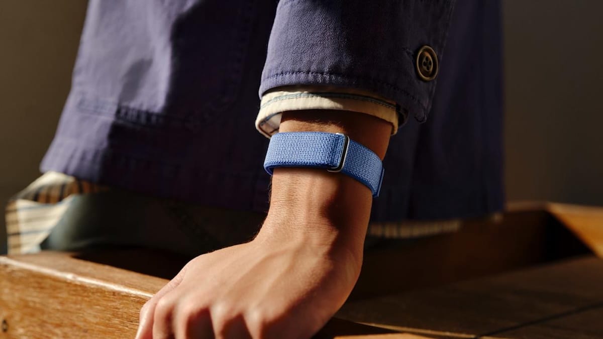 Man wearing suit with Fitbit Air