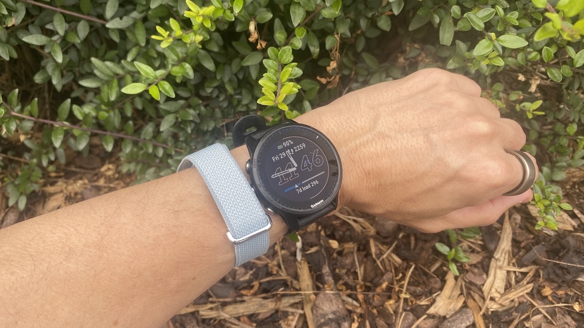 Fitbit Air on arm next to Garrmin