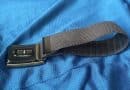WHOOP band with its optical sensor visible on blue fabric