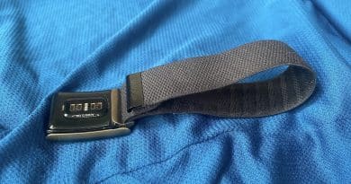 WHOOP band with its optical sensor visible on blue fabric