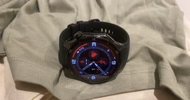 OnePlus Watch 3 on a folded shirt