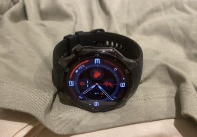 OnePlus Watch 3 on a folded shirt