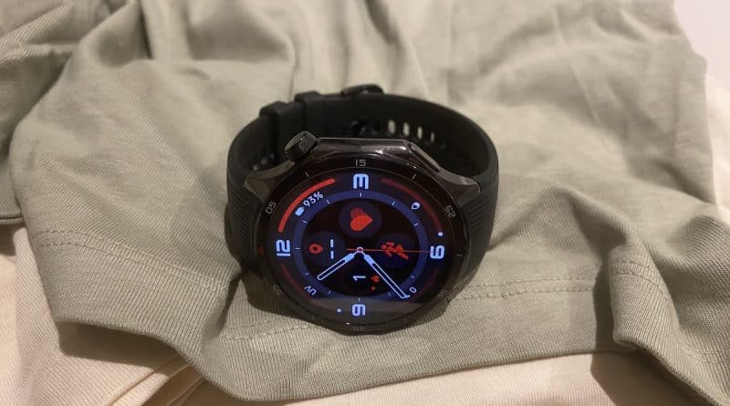 OnePlus Watch 3 on a folded shirt