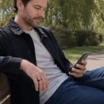 Smart ring person sitting on park bench